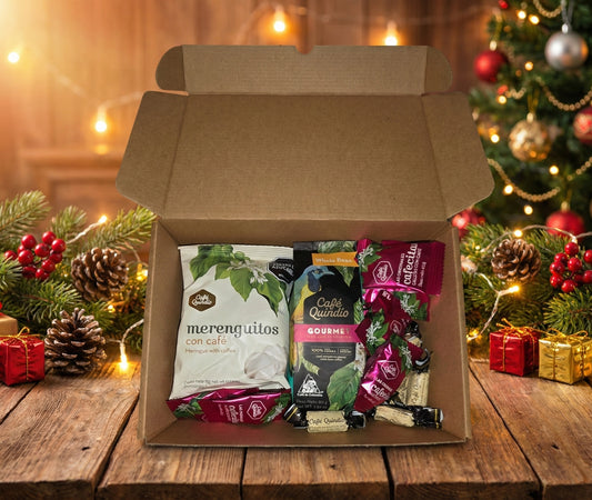 Gourmet Colombian coffee Christmas gift basket featuring Café Quindío ground coffee, coffee meringues, La Morelia Gourmet coffee, and coffee candies in a festive holiday box.